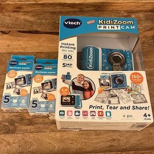 New in box. VTech KidiZoom PrintCam and 2 packs of Paper Refill